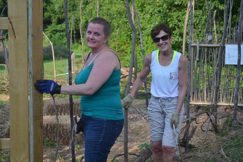 Michelle and Pam Waybright weaving those wattle roots.